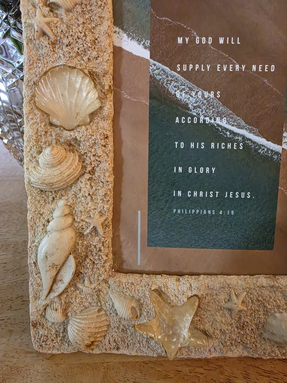 Textured beach picture frame decorated with real seashells and faux-sand finish